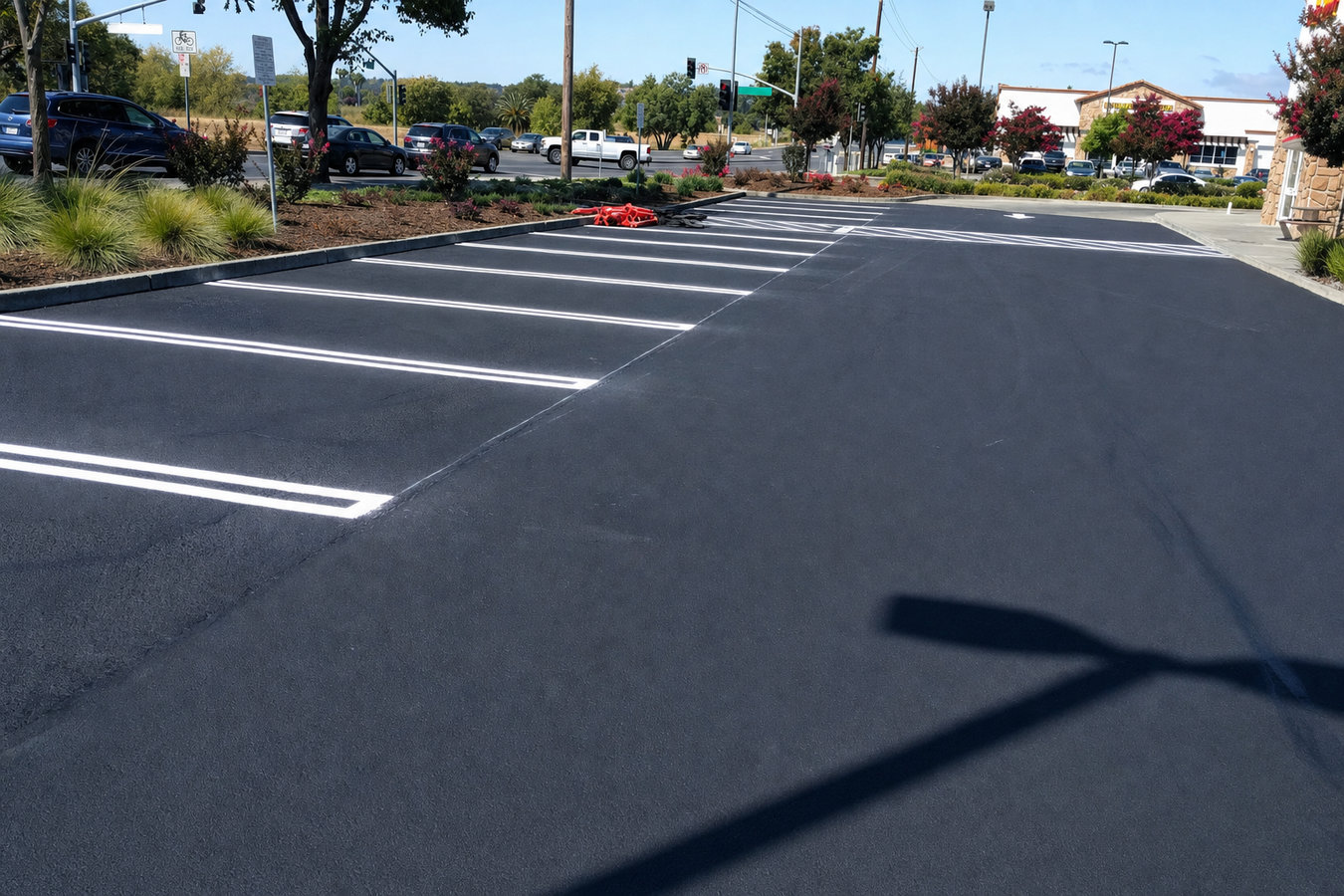 Asphalt sealcoating